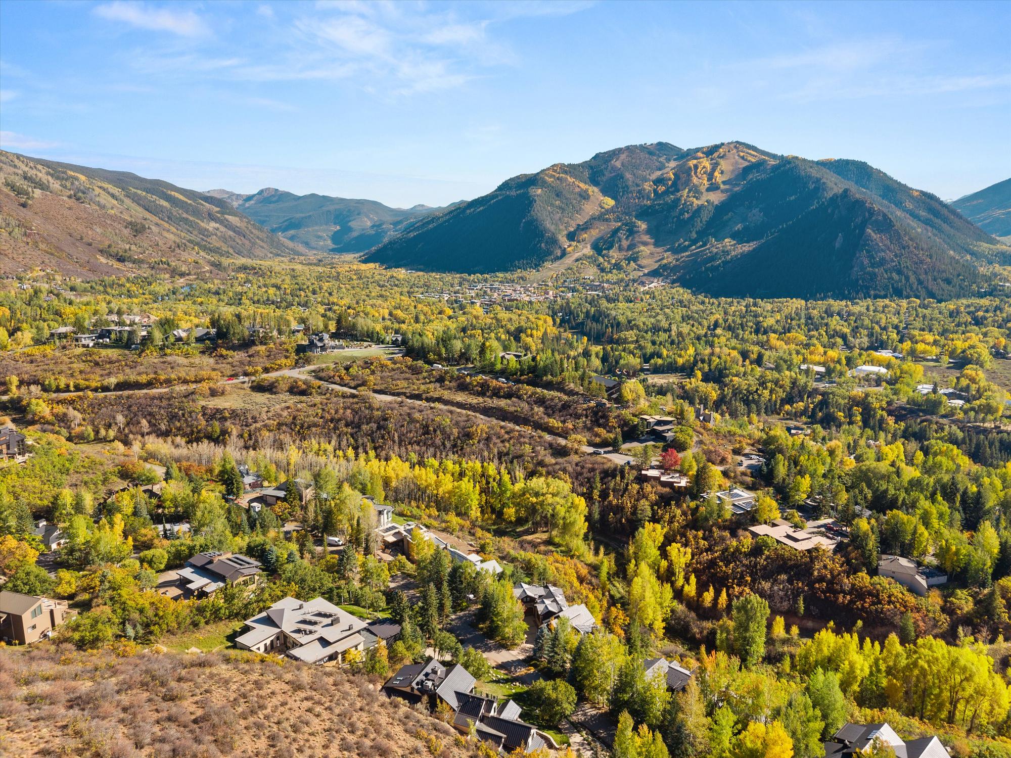 Aerial from Red Mountain toward downtown Aspen and Aspen Mountain, with the two homes, the Hotel Jerome and the gondola marked